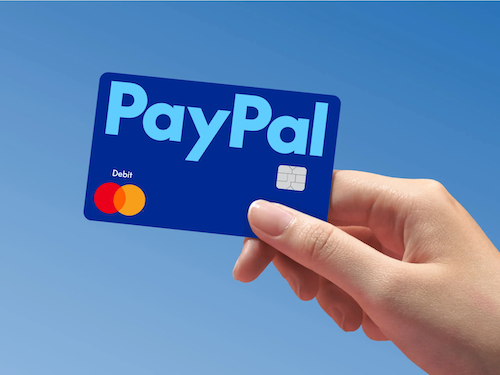 Hand holding a PayPal debit card