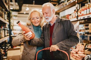 Older couple shopping in a grocery store