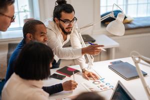 Group of people working in an office.