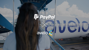 Woman boarding an Avelo Airlines plane on the runway.