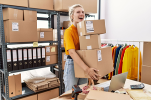 Successful female entrepreneur carrying packages