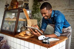 Man using a tablet at a bakery