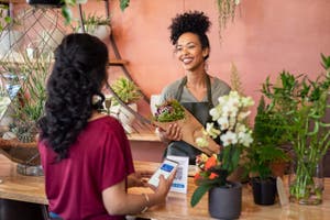 Customer paying with QR code at the florist