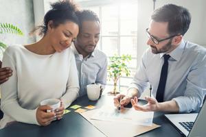 A couple speaking to a professional about payments