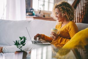 A woman uses a laptop for online shopping