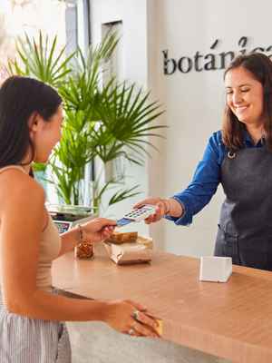 Customer paying for their purchase in-person with the sleek, fast, and easy to use Zettle by PayPal POS system