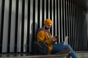 A man looks at a digital currency wallet on his phone.