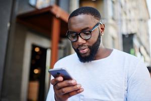 A man checks his cryptocurrency wallet on his phone.