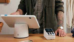 Image of a merchant setting up a purchase in person with the sleek, fast, and easy-to-use PayPal Zettle POS system