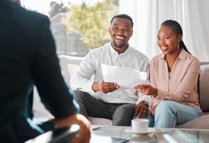 A couple reviews a savings plan.